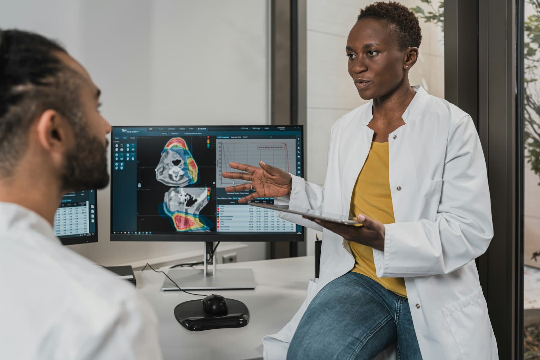 A primary-care visit underway in the exam room